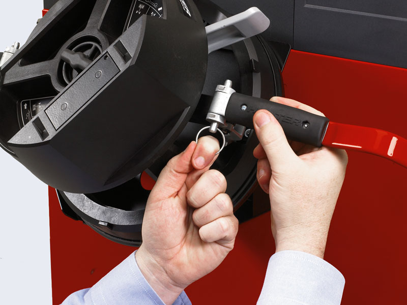 technician changing quickgrip adaptor arm 