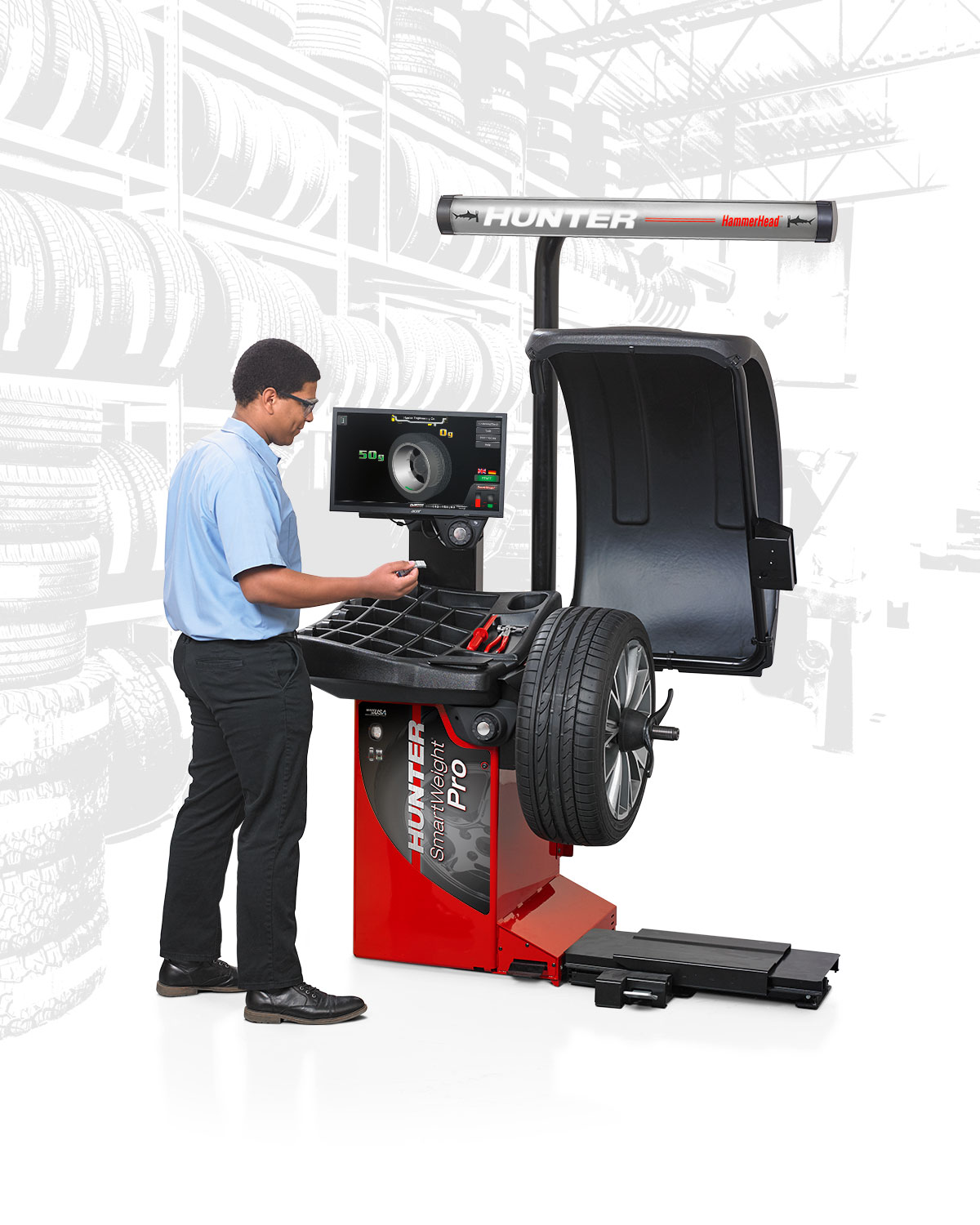 technician placing weight on smartweight pro balancer